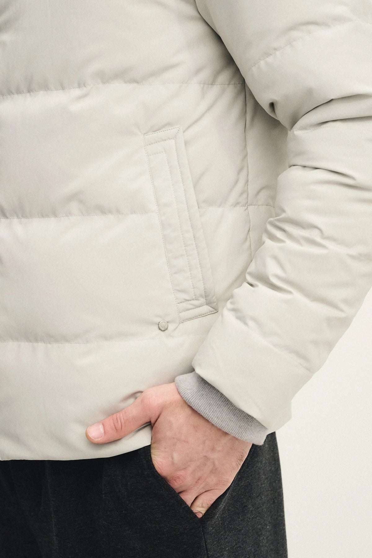 Technical fabric down jacket with wool, silk, and cashmere details
