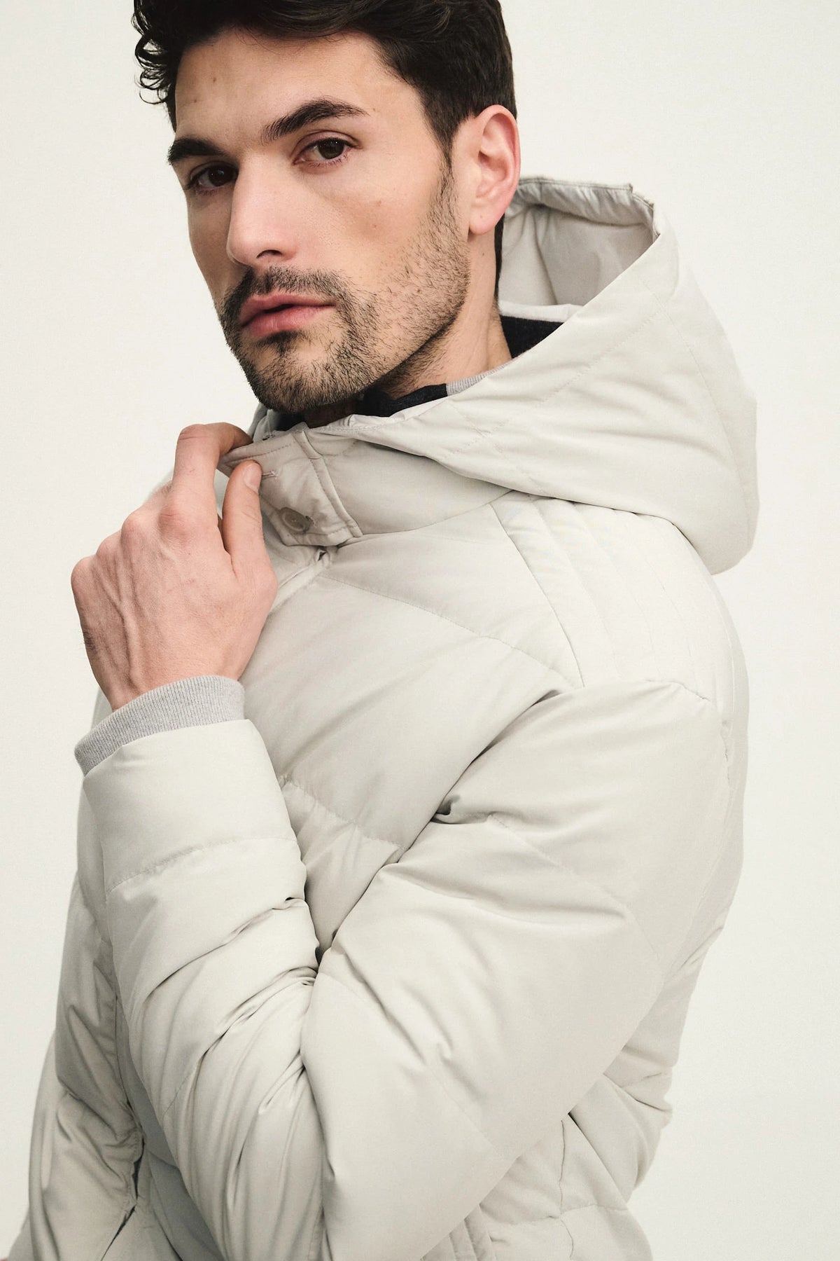 Technical fabric down jacket with wool, silk, and cashmere details