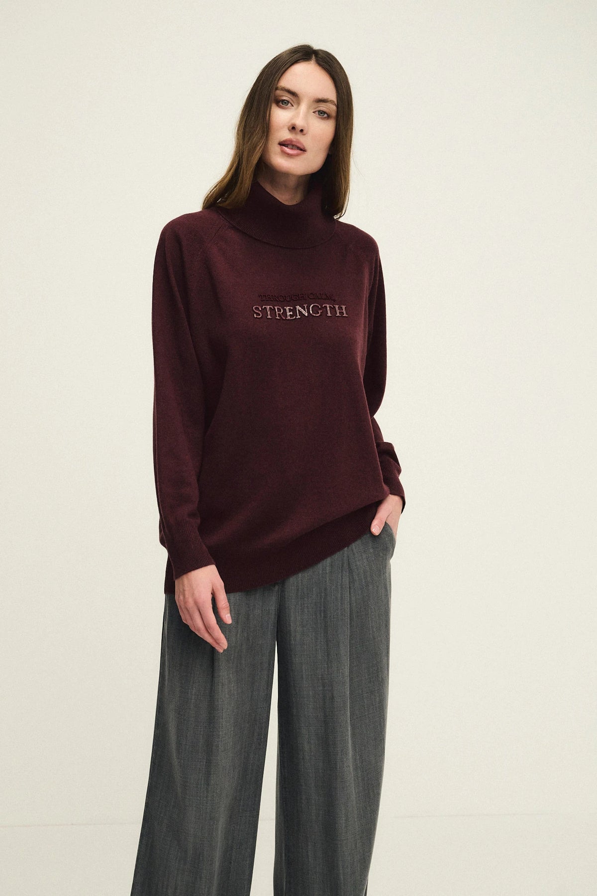 High-neck sweater in wool, silk, and cashmere with charm