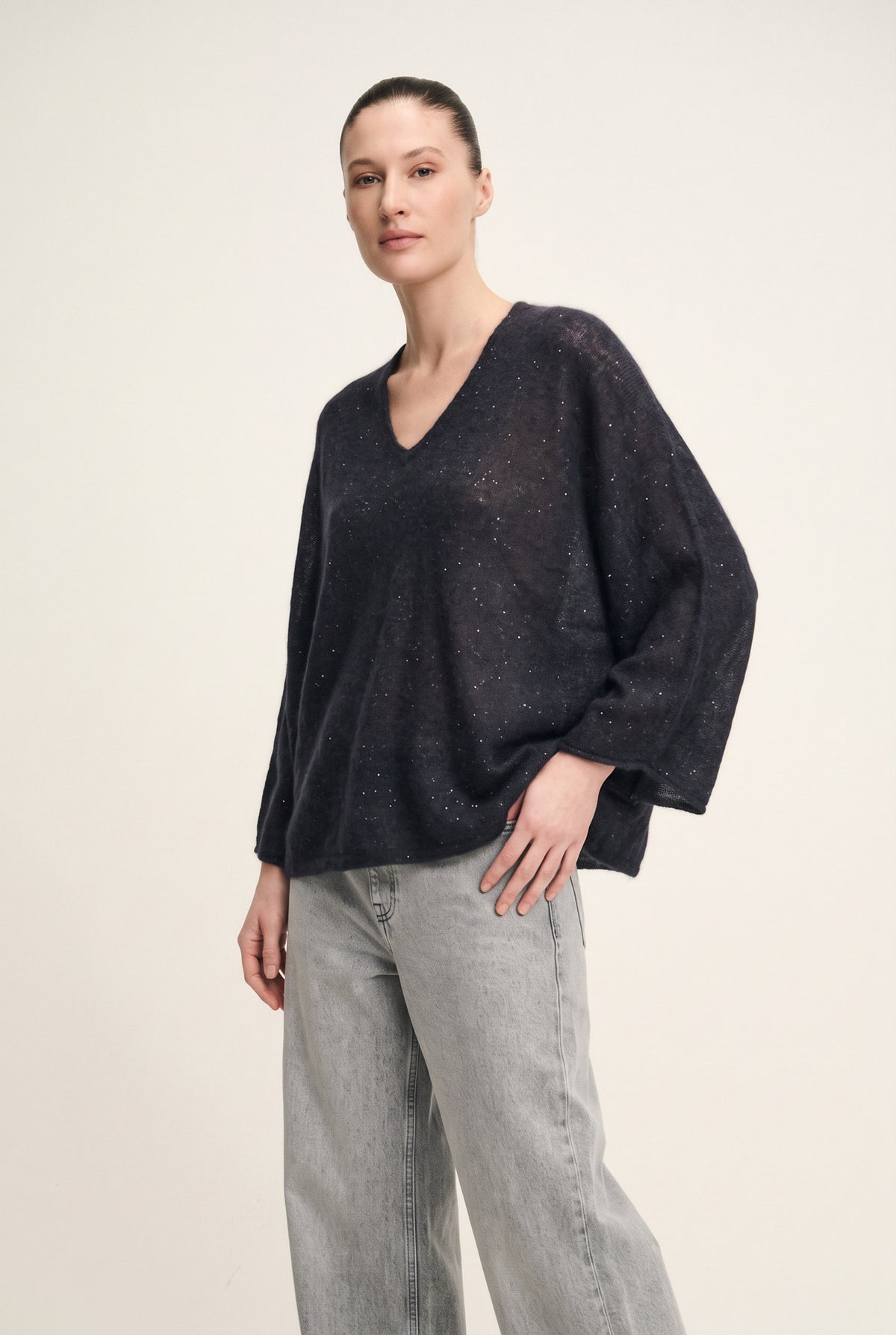 Shiny knit poncho with V-neck