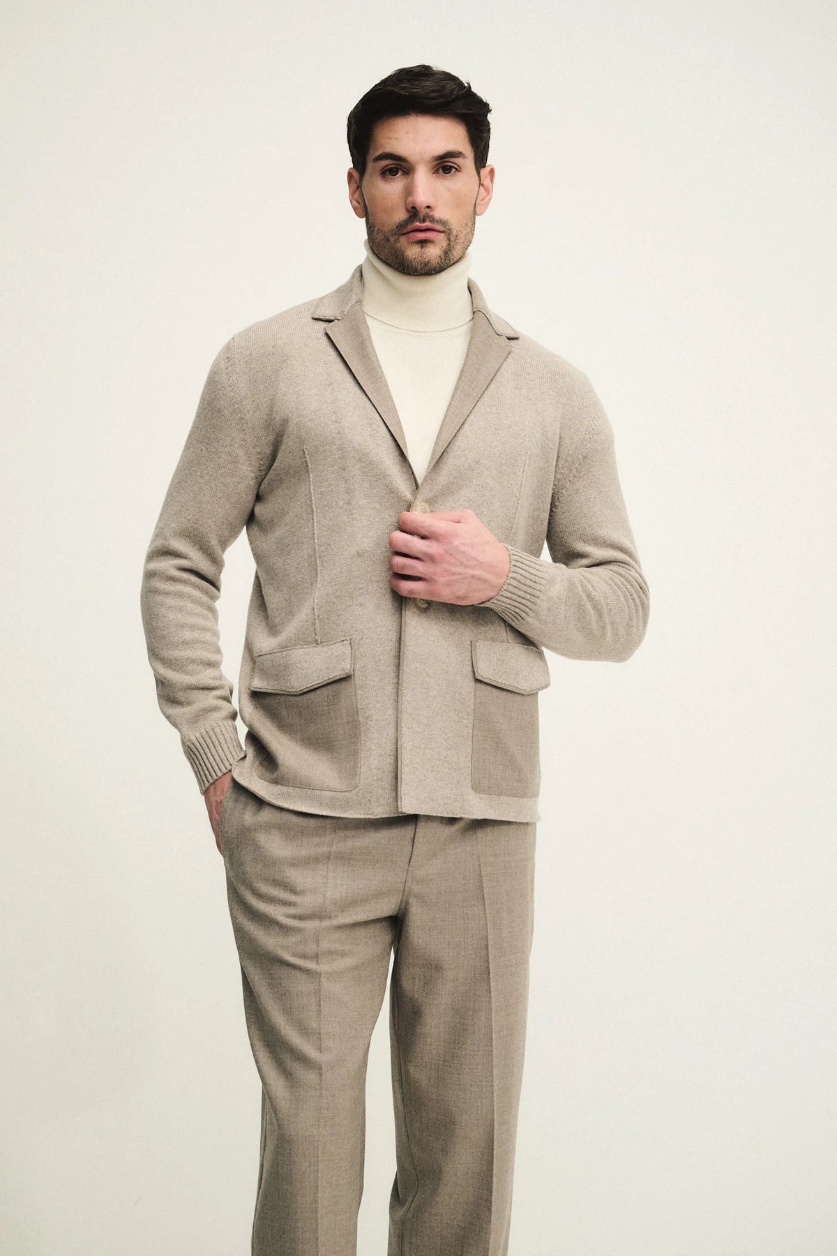 Knitted blazer with fabric appliqués